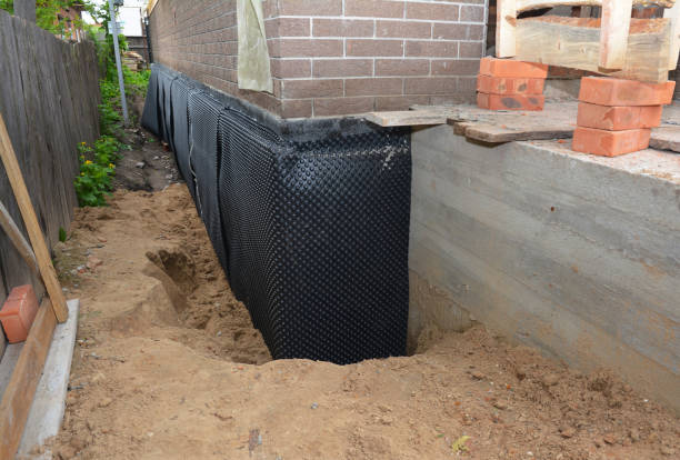 Happy homeowners after waterproofing job in Carrollton